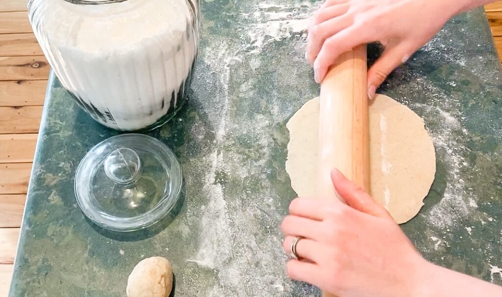 rolling sourdough tortillas out by hand