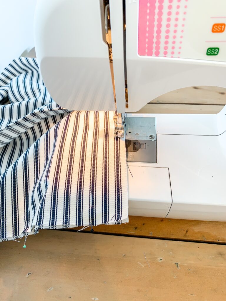 sewing first seams on easy to sew cushion cover in navy mattress ticking
