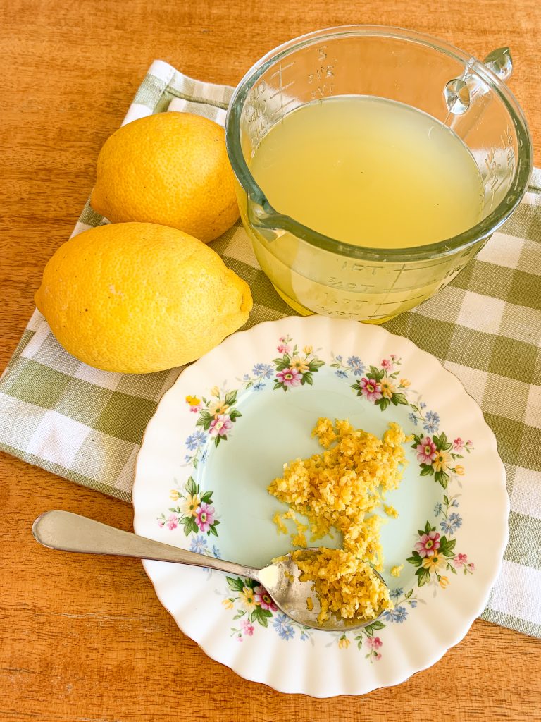 gingham table cloth with lemons and lemon juice and lemon zest